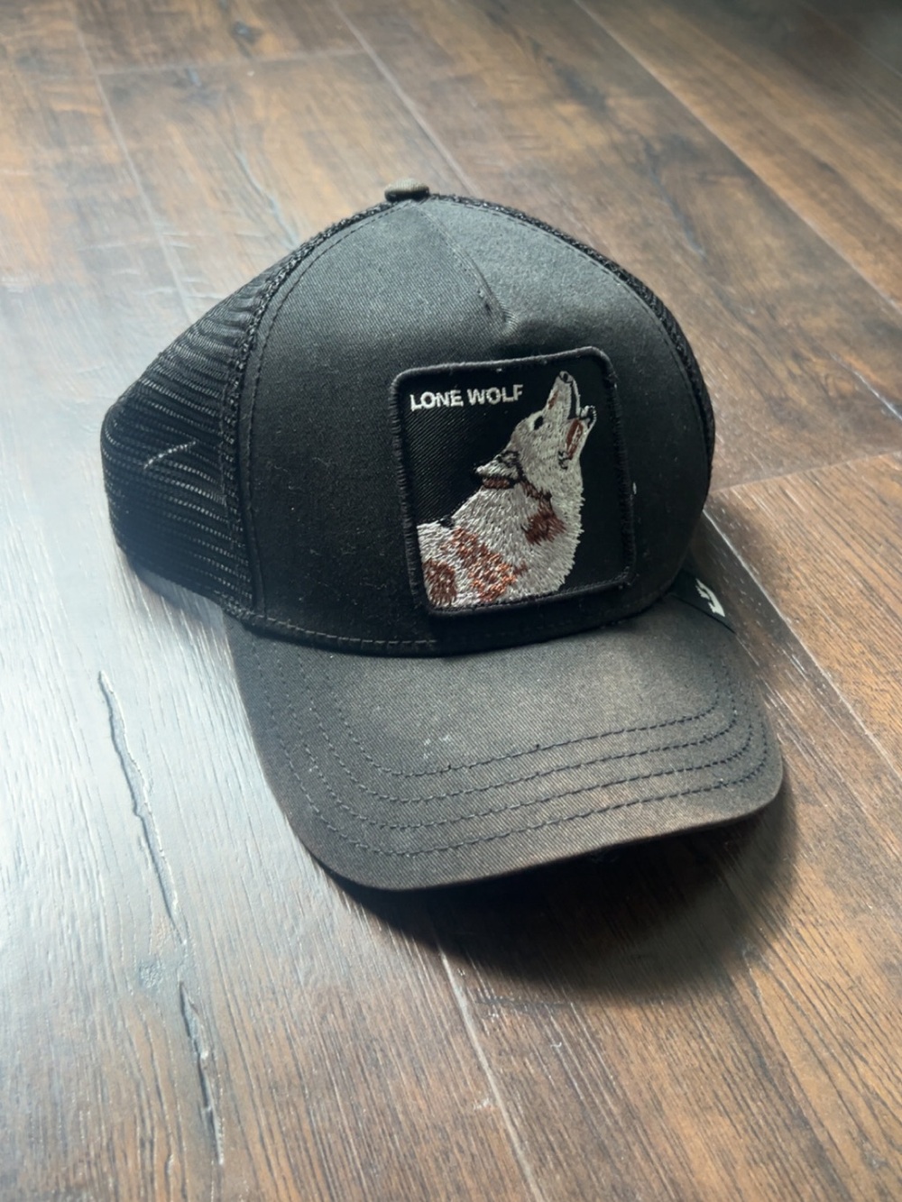 Black Trucker Cap with Howling Wolf Patch